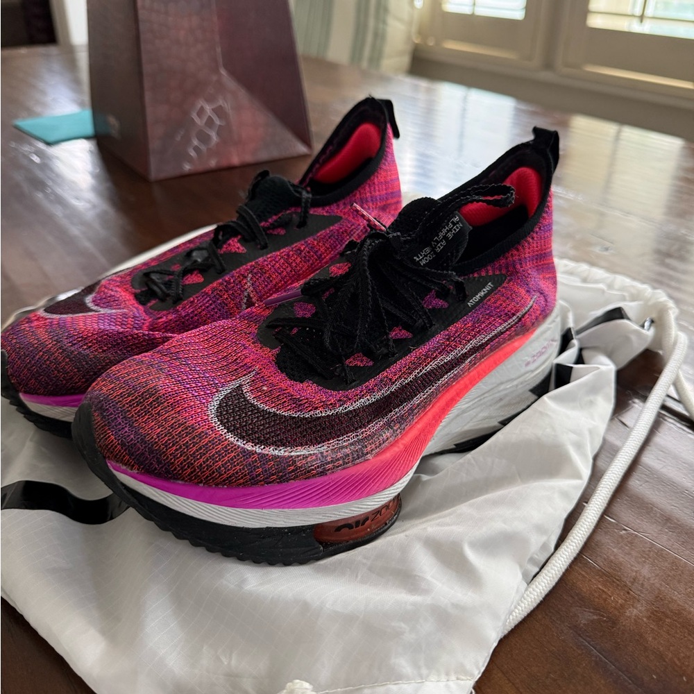 Nike Women’s Pink and Black Flyknit Running Shoes